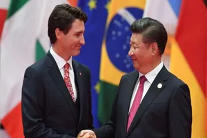 Thủ tướng Justin Trudeau và Chủ tịch Tập Cận Bình. Ảnh: AFP