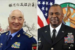 Bộ trưởng Quốc phòng Mỹ Lloyd Austin (phải), Phó Chủ tịch Quân ủy trung ương Trung Quốc Hứa Kỳ Lượng (trái). Ảnh: BELT&ROAD NEWS