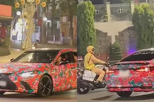 Xe ô tô dán giấy trang trí với họa tiết sặc sỡ... có bị phạt không?