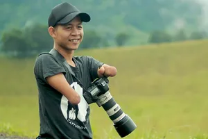 Nhiếp ảnh gia chuyên nghiệp mặc dù không có tay chân