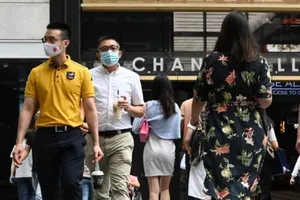 Singapore:Hàng trăm ca nhiễm cộng đồng mới mỗi ngày dù 81% dân số đã tiêm đầy đủ. Ảnh: AFP