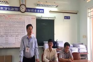 Cảnh giác dùng ống kính tê lê chụp đề thi từ tầng cao 