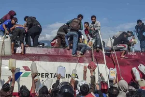 Indonesia: Cướp bóc tràn lan, người người kéo nhau rời Palu