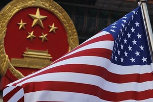 Bất chấp vụ Huawei, TQ nói vẫn đối thoại thương mại với Mỹ