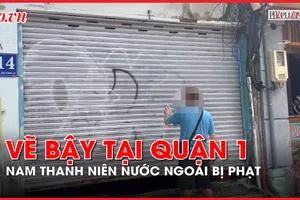 Phạt tiền 1 nam thanh niên người nước ngoài vì vẽ bậy trên mặt tiền quận 1 