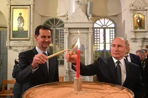 Tổng thống Nga Putin (phải) thăm Syria hôm 7-1.