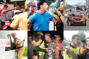 Giật cổ áo, phun nước bọt vào công an