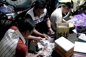 Nam thanh niên in tiền giả mang bán cho nhiều người