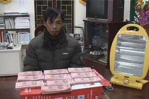 Phá đường dây tiền giả từ Trung Quốc về VN tiêu thụ