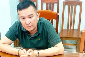 Trần Việt Hoàng bại công an. Ảnh: BTL