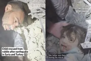 Đội cứu hộ cứu một bé gái từ đống đổ nát ở thị trấn Jinderis, tỉnh Aleppo (Syria). Ảnh: AP