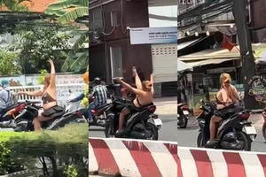 Vừa chạy xe vừa thả tay múa quay cuồng, cô gái sẽ bị xử lý ra sao?