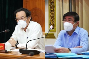 Bí thư Thành ủy TP.HCM Nguyễn Văn Nên (trái) và Chủ tịch Nguyễn Thành Phong tại cuộc họp trực tuyến vào sáng 12-7 với Chính phủ.