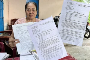 Nguyên đơn Nguyễn Thị Ngọc và hai bản án “cùng cha” nhưng phán quyết trái ngược.