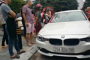 Bố dùng búa đập vỡ kính xe BMV để giải cứu con gái