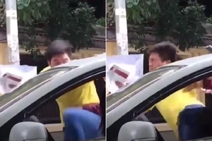 Nam thanh niên đạp tới tấp nữ tài xế ngồi trong xe