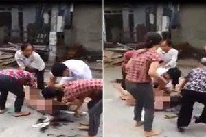 5 người lột quần áo, cắt tóc một phụ nữ giữa đường