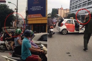 Bị dừng xe, tài xế taxi leo lên nóc 'ăn vạ'