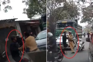 Đang xử phạt xe tải, CSGT bị lôi đi trên đường