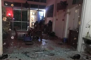 Nghi nổ súng thanh toán nhau, cửa kính vỡ vụn