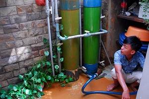 Dùng nước bẩn trong khu dân cư 