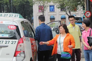 Cách nào hạ nhiệt cuộc chiến taxi?