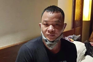 Cao Lượng Cố bị bắt khi đang lưu trú tại một khách sạn vào tối 25-7. Ảnh: CA