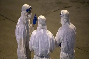 Nhóm chuyên gia của WHO được gửi đến Trung Quốc ngày 10-2. Ảnh: BLOOMBERG 