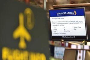Bảng thông tin chuyến bay của hãng Singapore Airlines tại sân bay Changi. Ảnh: MMEDIACORP