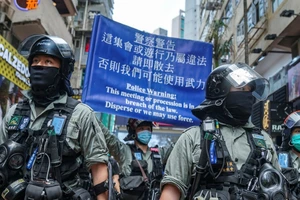 Cảnh sát làm nhiệm vụ ở quận Trung Tâm Hong Kong ngày 27-5. Ảnh: AFP