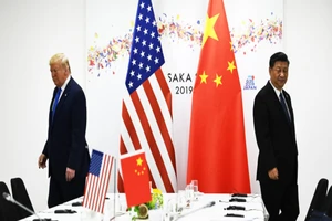 Chủ tịch Trung Quốc Tập Cận Bình (phải) và Tổng thống Mỹ Donald Trump. Ảnh: Brendan Smialowski/AFP