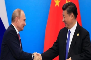 Tổng thống Nga Vladimir Putin và Chủ tịch Trung Quốc Tập Cận Bình. Ảnh: REUTERS.