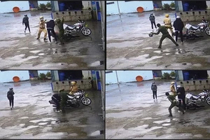 Vụ clip 2 người trong trang phục cảnh sát đánh người: Tạm đình chỉ 4 công an 