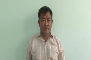 Nguyễn Quốc Việt bị bắt giữ sau hơn 14 năm bỏ trốn (ảnh VĂN VŨ)