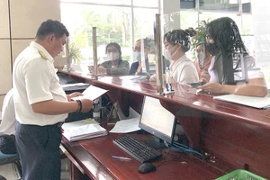 Bộ Tài chính cho biết sẽ tìm mọi giải pháp để làm tốt công tác hoàn thuế. Ảnh: Q.HUY