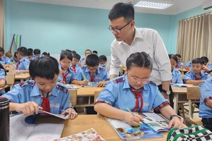 Học sinh Trường THCS Lý Tự Trọng (quận Gò Vấp, TP.HCM) trong một tiết học. Ảnh: NGUYỄN QUYÊN