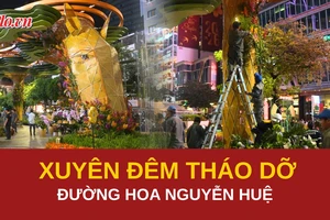 Tất bật dọn dẹp đường hoa Nguyễn Huệ trong đêm