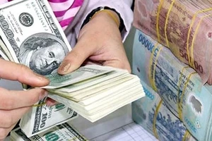Tỷ giá trung tâm tăng hơn 1%, can thiệp khi cần thiết