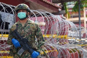 Malaysia ghi nhận mức tử vong vì COVID-19 trong ngày cao kỷ lục. Ảnh: AFP