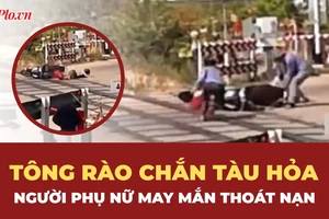 Người phụ nữ tông rào chắn tàu hỏa, may mắn thoát chết trong gang tấc