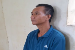 Cầm dao rình chém người tranh chấp đất