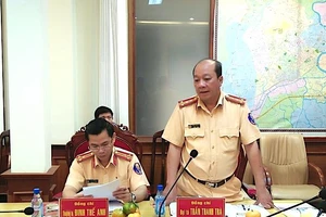 Đại tá Trần Thanh Trà trước đó làm Phó Cục trưởng Cục CSGT, Bộ Công an (bìa phải) vừa qua đời. Ảnh: CAND.COM.VN