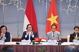 Thủ tướng Phạm Minh Chính và Tổng thống Joko Widodo đồng chủ trì Đối thoại - Ảnh: VGP