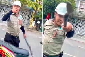 2 người mặc áo bảo vệ chặn ô tô, cầm hung khí đe dọa tài xế ở TP.HCM