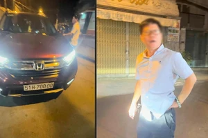 Người điều khiển chiếc xe ô tô đẩy cô gái lên nắp capo chạy khoảng 1km ở Tân Bình. Ảnh cắt từ clip