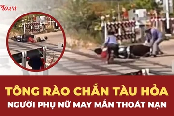 Người phụ nữ tông rào chắn tàu hỏa, may mắn thoát chết trong gang tấc