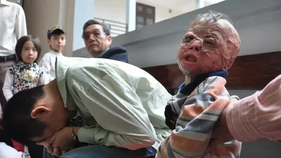 Chùm ảnh: Phiên tòa xét xử người cha nhẫn tâm đốt con mới ba tuổi