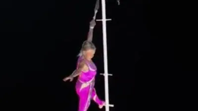 Cụ bà 81 tuổi biểu diễn leo... cột cao 26 mét