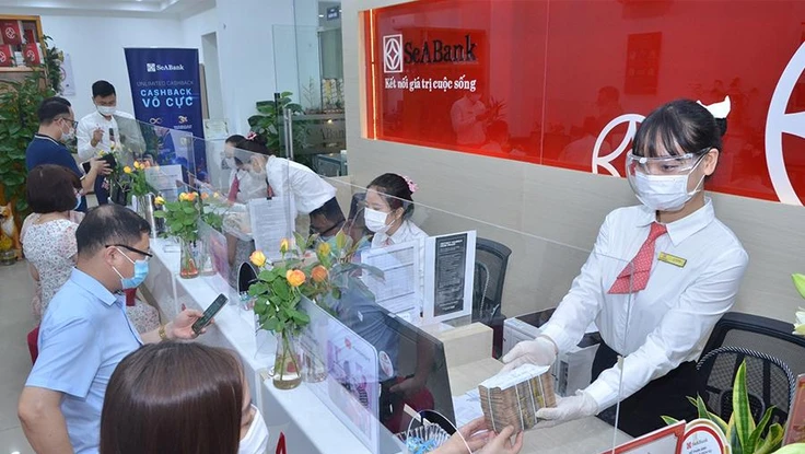 Vay vốn ngân hàng được xem là một trong những kênh huy động khả quan đối với doanh nghiệp. Ảnh minh họa: P.MINH