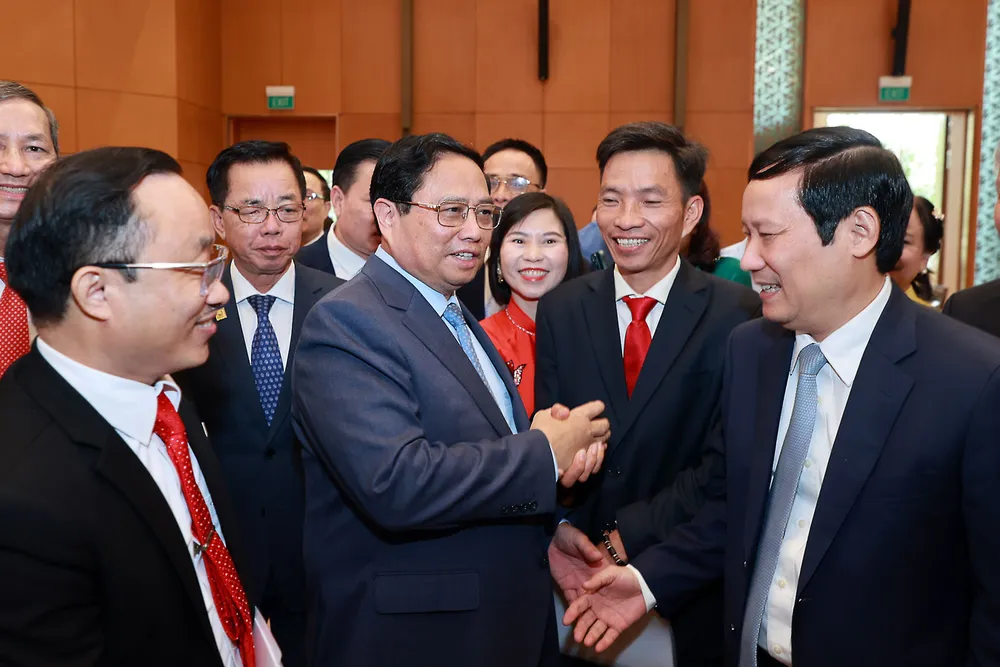 Thủ tướng Phạm Minh Chính cùng đại diện các doanh nghiệp tại buổi gặp gỡ nhân ngày Doanh nhân Việt Nam. Ảnh: NHẬT BẮC/VGP đột phá về thể chế